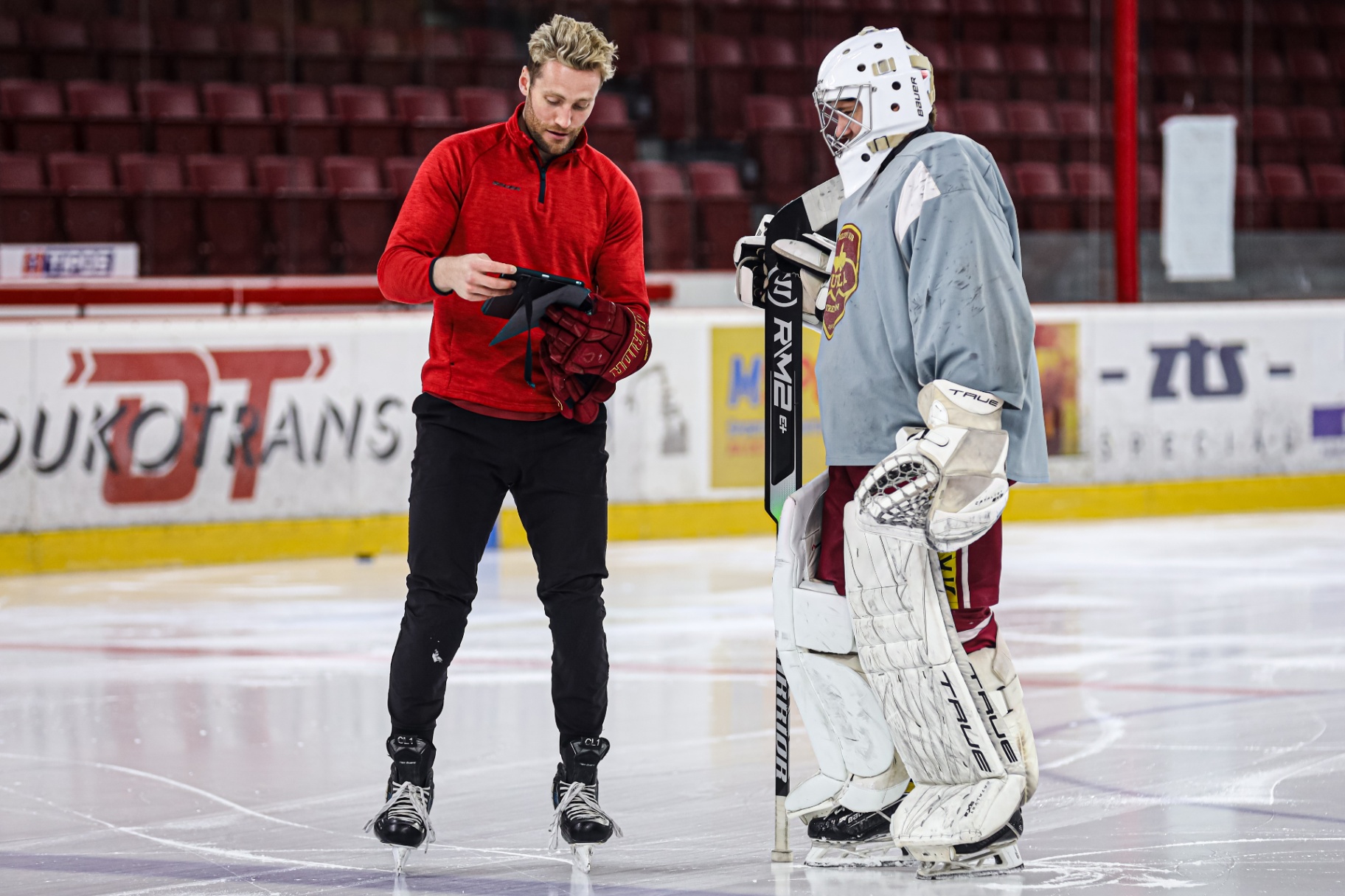 iPad video breakdown with athlete on the bench
