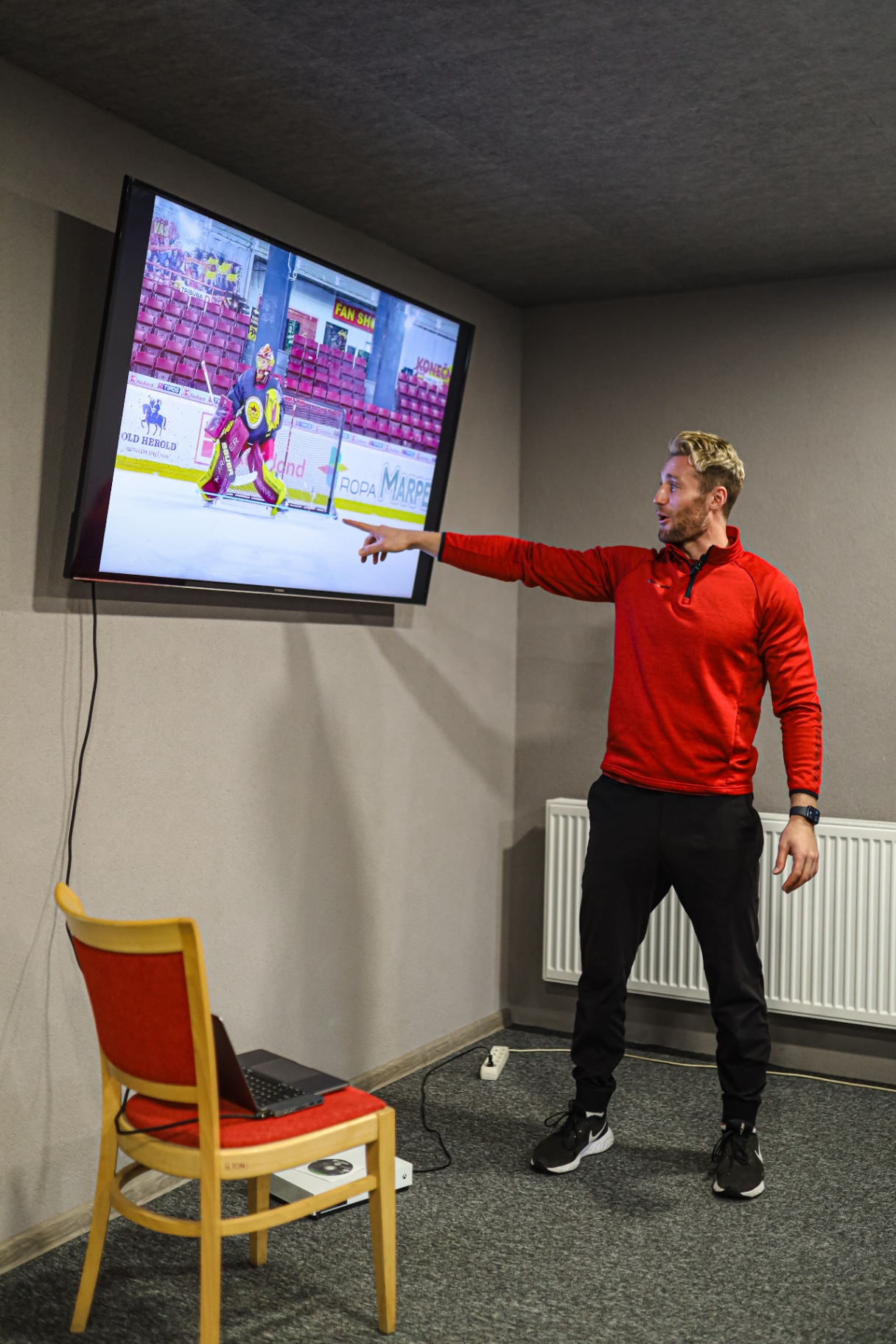 Reviewing game film on the TV in the lounge